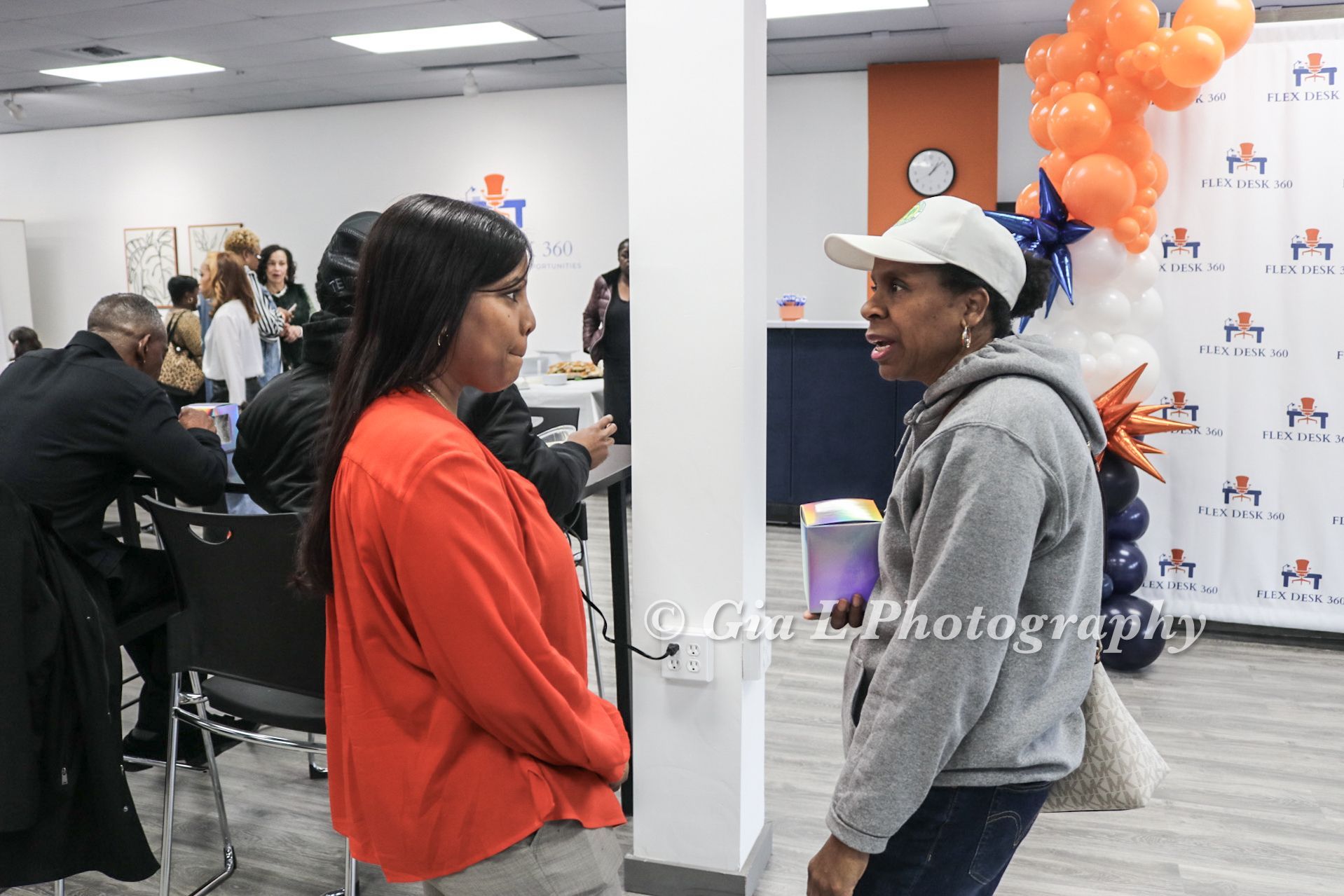 Guests standing inside Flex Desk 360 during the ribbon cutting ceremony