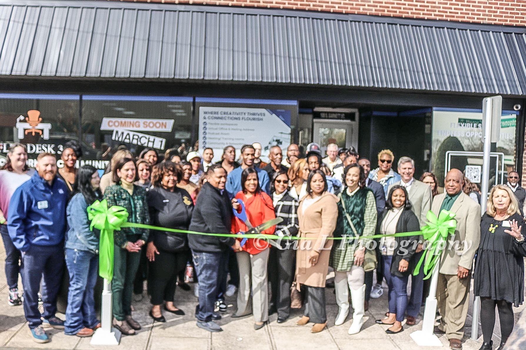 Ribbon cutting outside Flex Desk 360